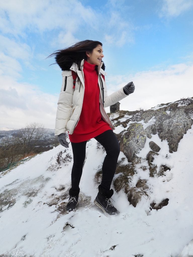 girl mountain climbing snow