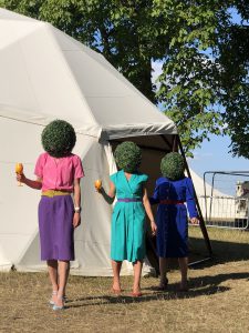 Veuve clicquot hedge head ladies at Wilderness Festival topiary gardening